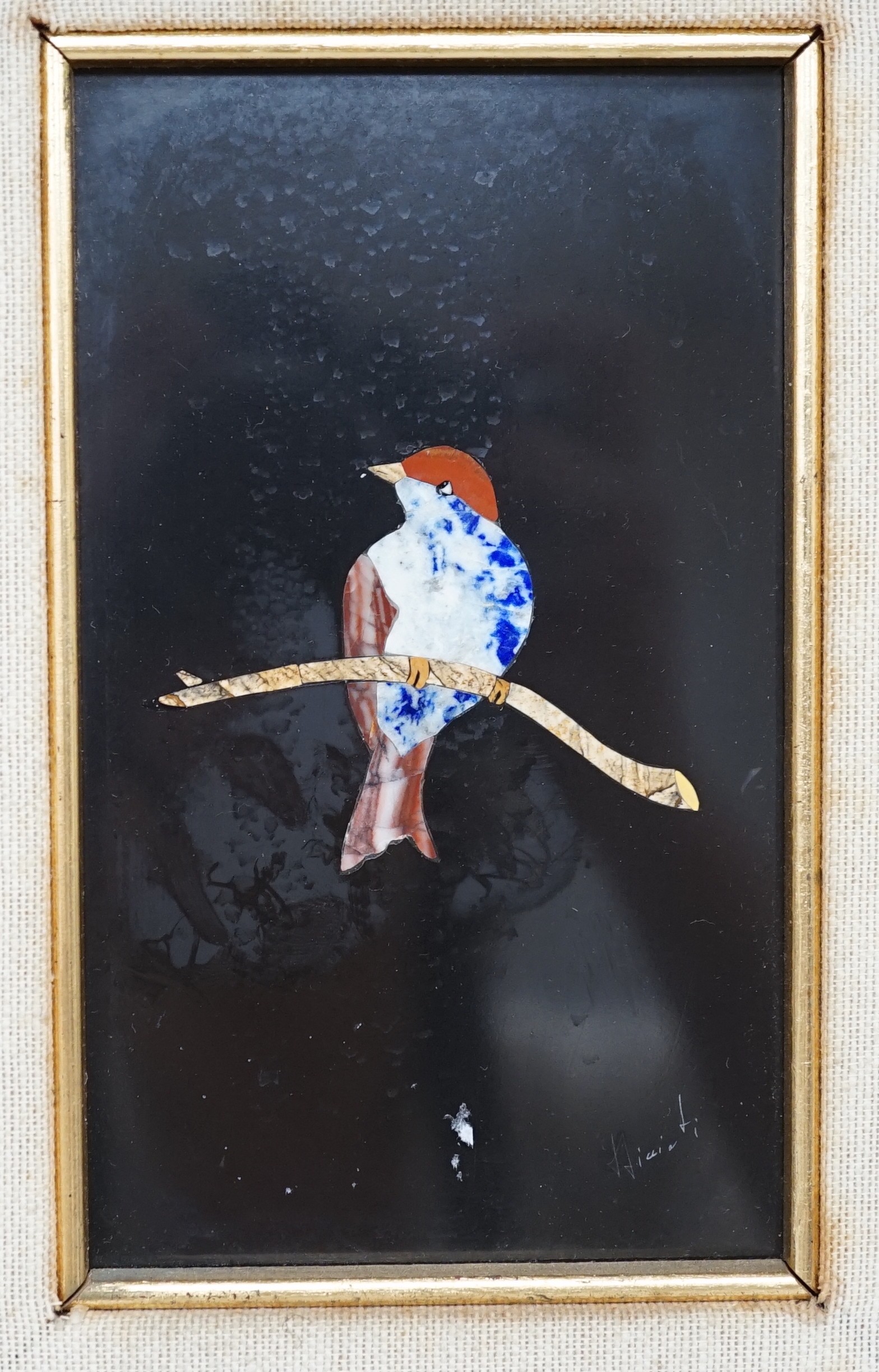 A 20th century Italian pietra dura marble plaque, depicting a bird on a branch, indistinctly signed. 14x8.5cm excl frame.